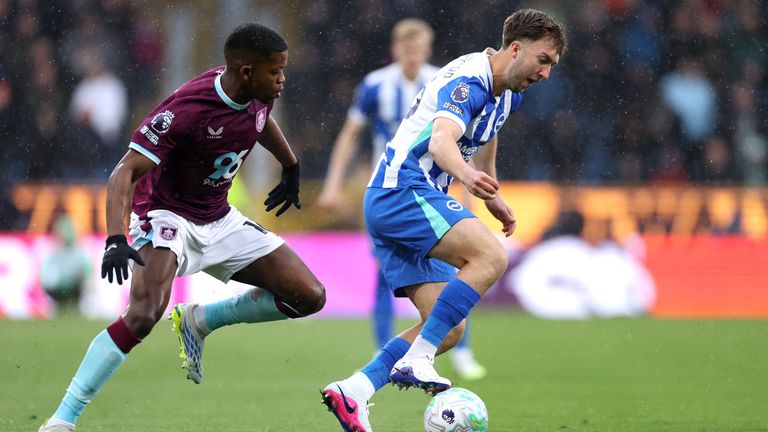 Jack Hinshelwood is challenged by Florentino Luis