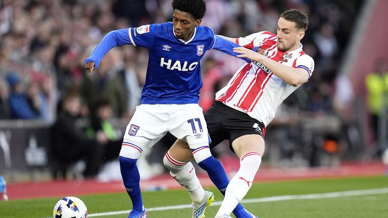 Jaden Philogene is tackled by Taylor Harwood-Bellis