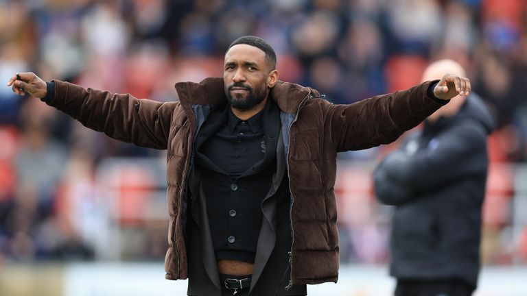 Jermain Defoe celebrates after Woking came from two goals down to earn a point on his managerial debut