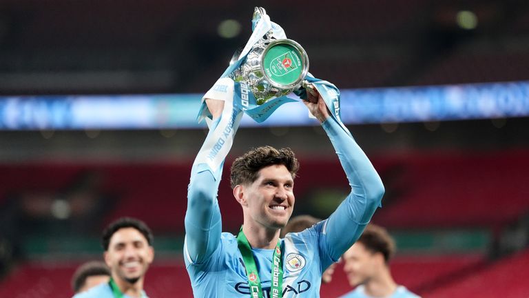 Manchester City's John Stones with the trophy after winning the Carabao Cup Final at Wembley Stadium, London. Picture date: Sunday March 22, 2026. PA Photo. Photo credit should read: Adam Davy/PA Wire...RESTRICTIONS: EDITORIAL USE ONLY No use with unauthorised audio, video, data, fixture lists, club/league logos or "live" services. Online in-match use limited to 120 images, no video emulation. No use in betting, games or single club/league/player publications.