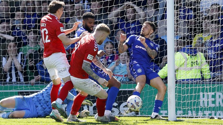 York City's Josh Stones scores an injury-time equaliser against Rochdale to win promotion from League Two