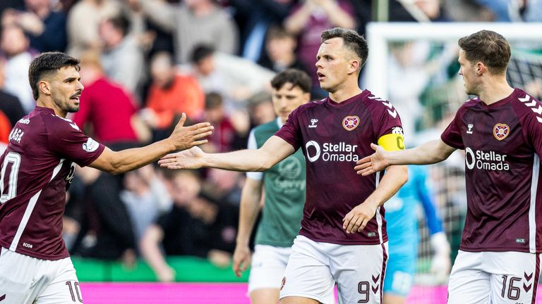 Hearts' Lawrence Shankland celebrates his involvement in Hibernian's Warren O'Hora scoring an own goal to make it 1-1