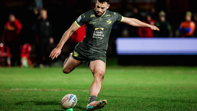 Leeds' Jake Connor kicks for goal.