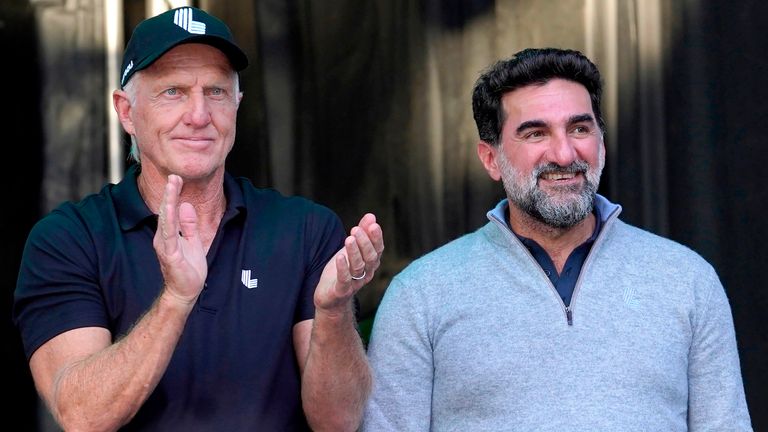 FILE - LIV Golf CEO Greg Norman, left, applauds Yasir Al-Rumayyan, Governor of Public Investment Fund of Saudi Arabia, at the LIV Golf Invitational-Chicago tournament Sept. 18, 2022, in Sugar Hill, Ill. (AP Photo/Charles Rex Arbogast, File)