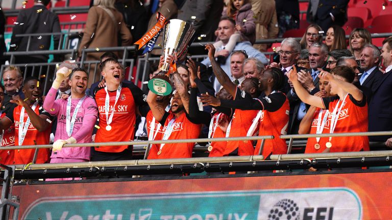 Luton's Nahki Wells lifts the Vertu Trophy after beating Stockport at Wembley
