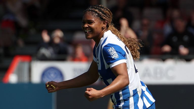 Madison Haley celebrates scoring her second goal against Man City
