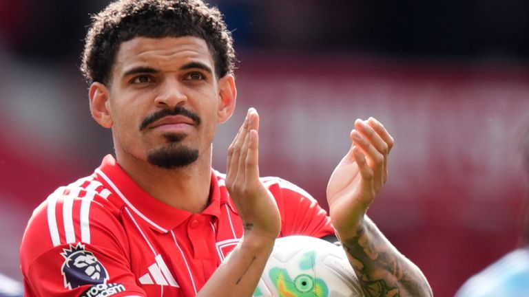 Morgan Gibbs-White celebrates with the match ball after his hat-trick helped Nottingham Forest beat Burnley 4-1