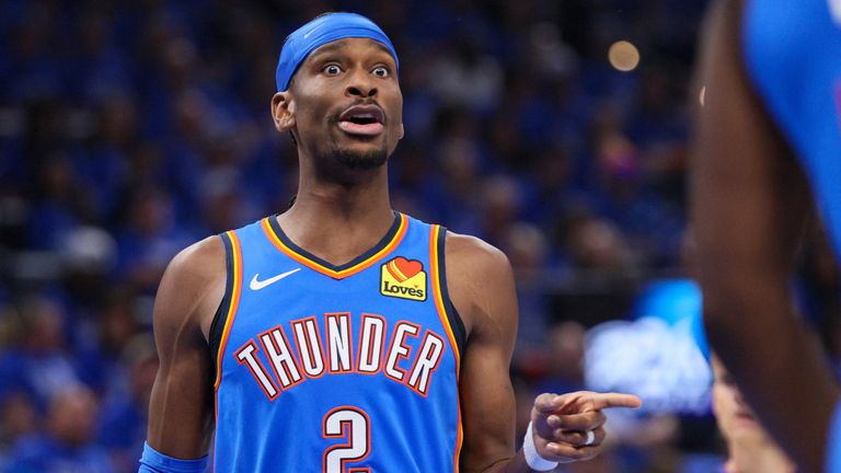 Oklahoma City Thunder guard Shai Gilgeous-Alexander talks to a teammate during the first half in Game 1 of a first-round NBA playoffs basket