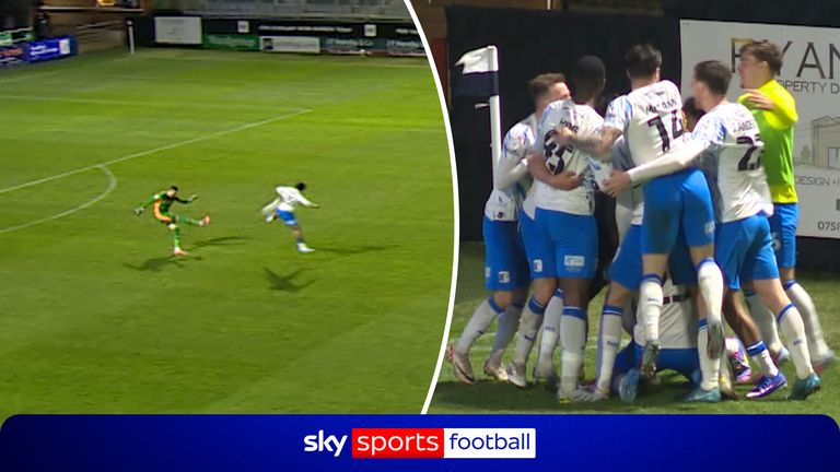 Barrow's Josh Gordon closes down Oldham's goalkeeper Mathew Hudson as he goes to punt the ball long to turnaround a quick-fire double for the home side. 