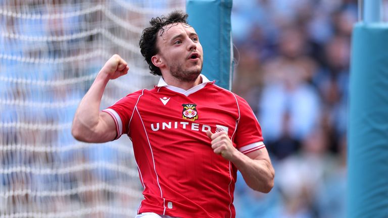 Ollie Rathbone of Wrexham celebrates scoring their equaliser