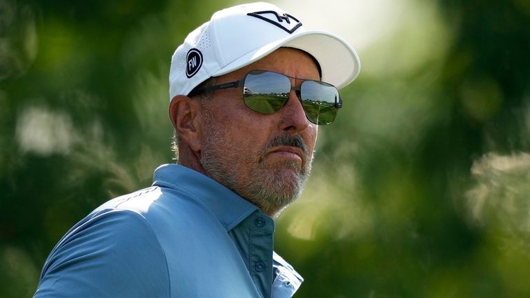 Phil Mickelson watches his tee shot on the 13th hole during the first round of the U.S. Open golf tournament at Oakmont Country Club Thursda