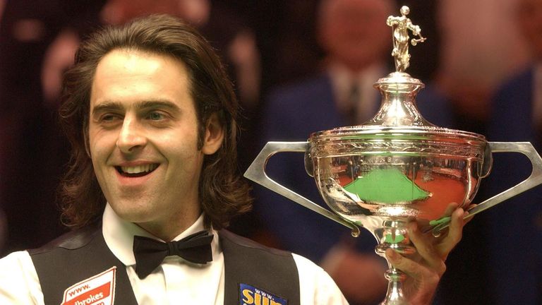 England's Ronnie O'Sullivan celebrates with the trophy after beating Scotland's Graeme Dott 18-8 frames at the Final of the Embassy World Ch