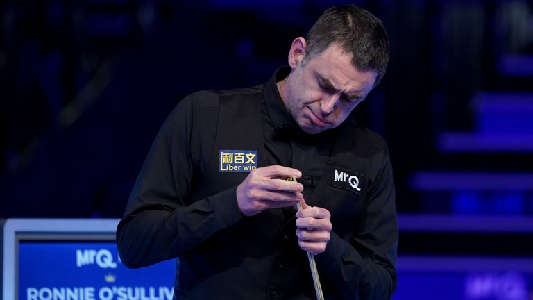 Ronnie O'Sullivan chalks his cue during the MrQ Masters Final against Ali Carter (not pictured) on day 8 at Alexandra Palace, London. Pictur