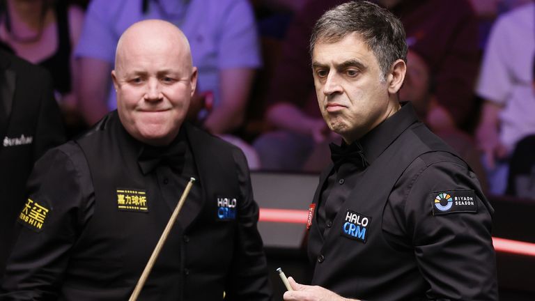 Ronnie O'Sullivan (right) during his match against John Higgins (left) on day eight of the Halo World Snooker Championship 2026 at the Cruci
