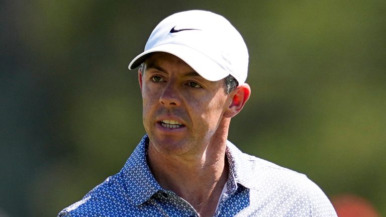 Rory McIlroy, of Northern Ireland, waves after his putt on the third hole during the third round of the Masters