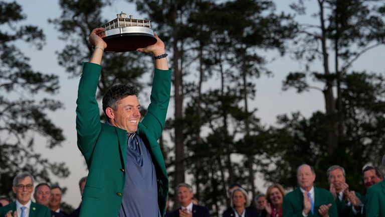 FILE - Winner Rory McIlroy, of Northern Ireland, holds the trophy at the Masters golf tournament, Sunday, April 13, 2025, in Augusta, Ga. (AP Photo/David J. Phillip, File)