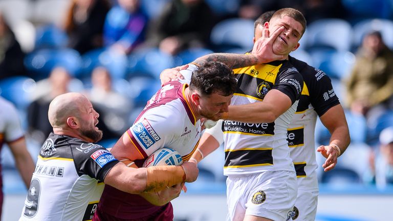 Fenton Rogers fends off York Knights' Will Roberts as Paul McShane puts in a tackle