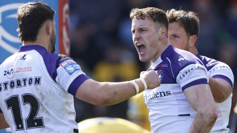Wakefield Trinity's Jake Trueman celebrates scoring the opening try against Castleford