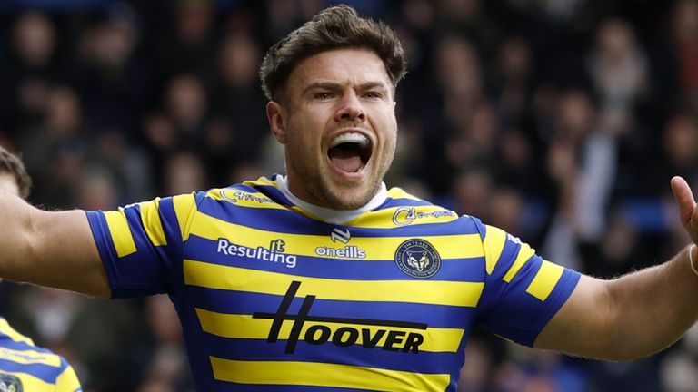 Warrington Wolves' Joe Philbin celebrates after scoring a try