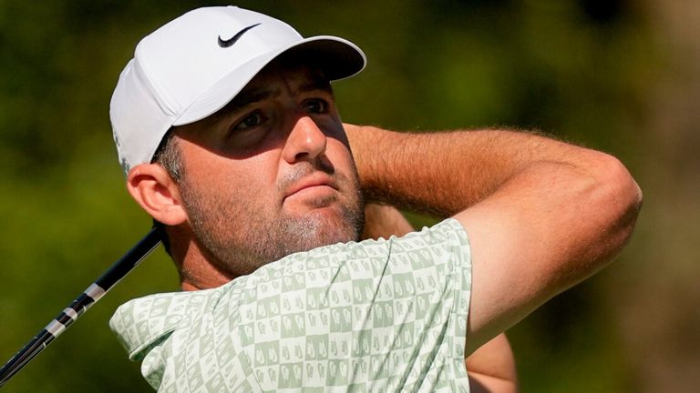 Scottie Scheffler watches his tee shot on the 11th hole during the first round of The Masters 