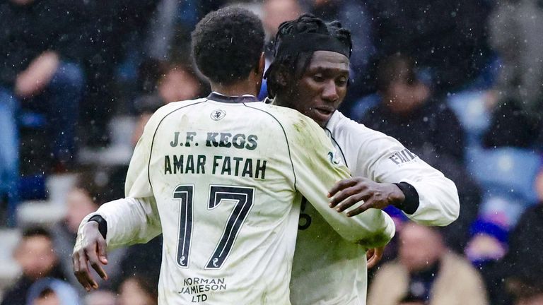 Amar Fatah celebrates with Emmanuel Agyei after pulling a goal back for Dundee United at Ibrox