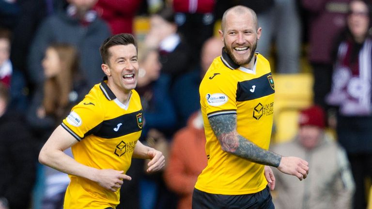 Stevie May celebrates with Cammy Kerr after giving Livingston an early lead against Hearts