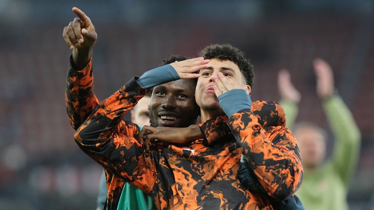 Shakhtar's Lassina Traore, left, and Alaa Ghram celebrate after beating AZ Alkmaar