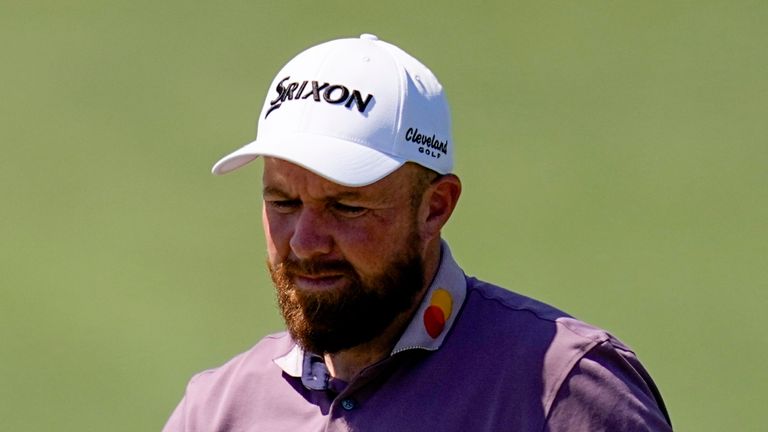 Shane Lowry, of Ireland, waves after his putt on the second hole during the third round of the Masters golf tournament
