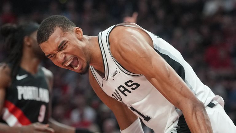 San Antonio Spurs center Victor Wembanyama reacts after a shot during the first half in Game 4 of a first-round NBA basketball playoffs series against the Portland Trail Blazers, in Portland, Ore., Sunday, April 26, 2026. (AP Photo/Jenny Kane)