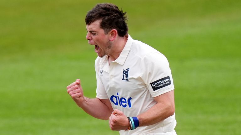 Warwickshire's Ethan Bamber celebrates the wicket of Surrey's Ollie Pope 