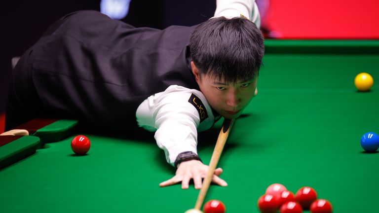Zhao Xintong produced a moment of brilliance to pot three balls at once during his match against Shaun Murphy