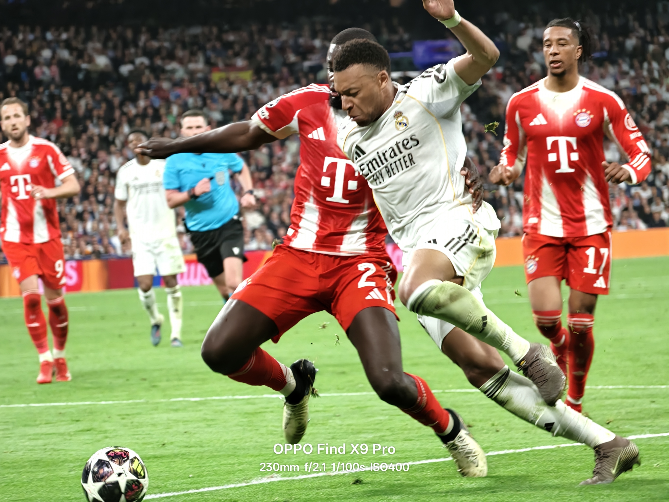 Michael Olise looks on as Kylian Mbappe runs at the Bayern Munich defence