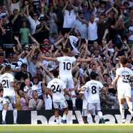 Tom Cairney celebrates after doubling Fulham's lead against Newcastle