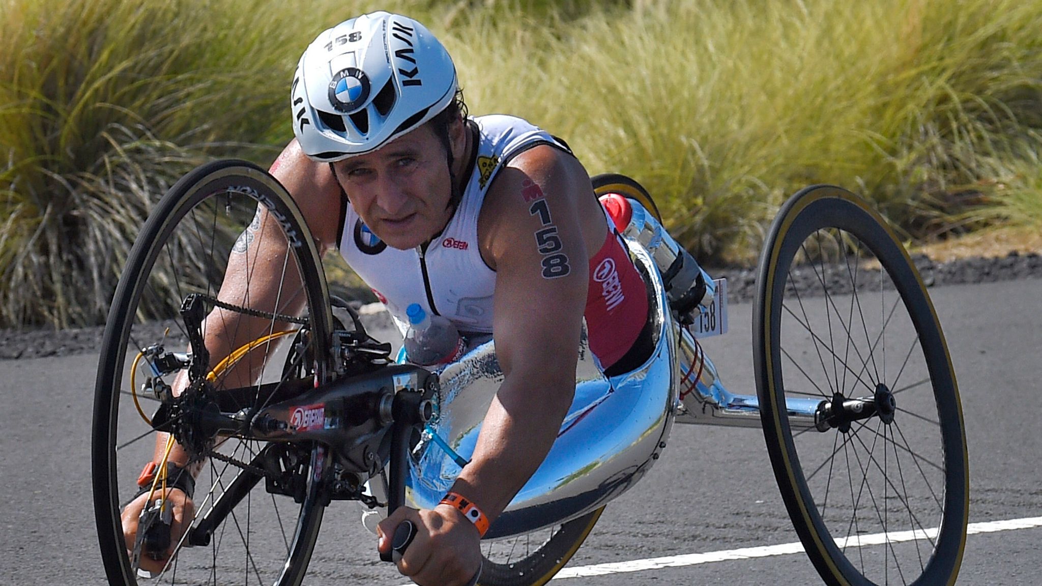 Alex Zanardi, of Italy, rides during the cycling portion of the Ironman World Championship Triathlon, in Kailua-Kona, Hawaii. Race car drive