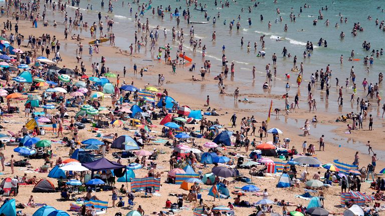 People enjoy the hot weather on Bournemouth beach.
Pic: PA