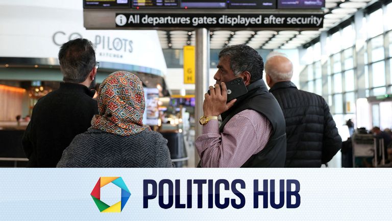 A group look at a departure board in Heathrow Airport after disruption in the Middle East. File pic: Reuters