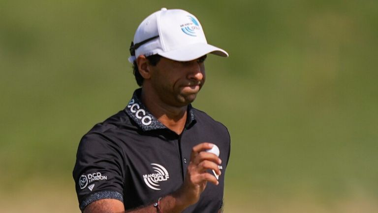 Aaron Rai, of England, waves on the eighth green during the final round of the PGA Championship golf tournament at Aronimink Golf Club
