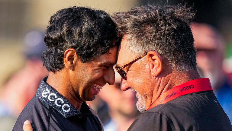 Aaron Rai hugs Justin Rose's caddie Mark Fulcher after closing out PGA Championship victory
