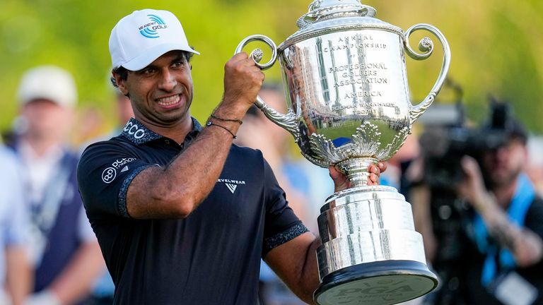 England's Aaron Rai holds the Wanamaker Trophy after winning the 2026 PGA Championship at Aronimink Golf Club (Associated Press)
