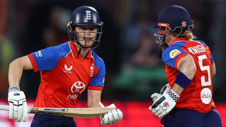 Amy Jones and Heather Knight scamper for runs in England's chase of 189 against India in the first T20