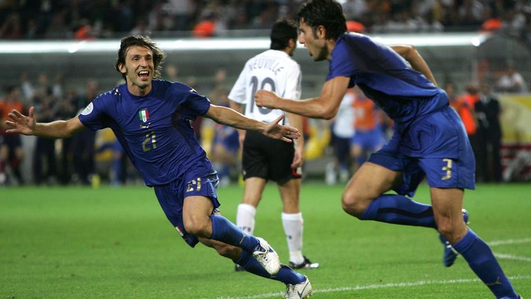 Fabio Grosso with Andrea Pirlo in pursuit after scoring for Italy in extra-time of their 2006 World Cup semi-final against Germany