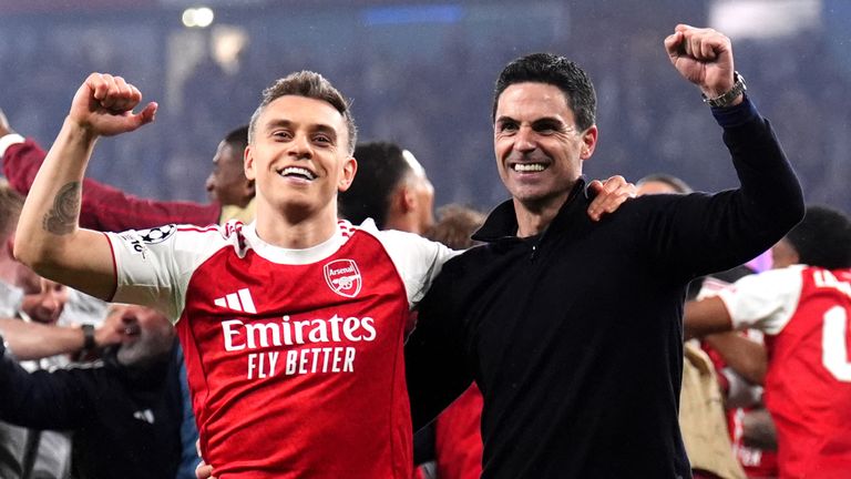 Mikel Arteta celebrates with Leandro Trossard after the win over Atletico Madrid