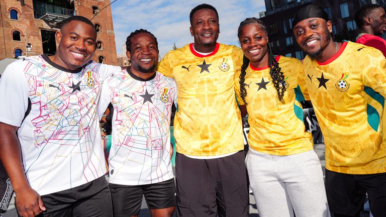 Asamoah Gyan with fans as he wears the new PUMA World Cup kit