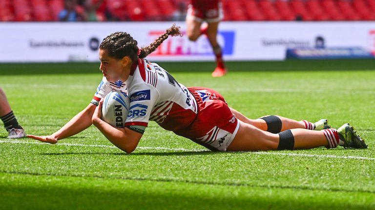 - Wigan's Beri Salihi scores a try against St Helens.