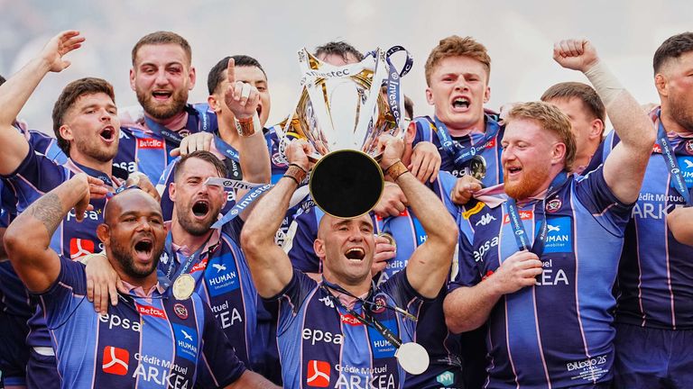 Bordeaux's Maxime Lucu lifts the trophy after winning the European Champions Cup final rugby union match between Leinster and Bordeaux