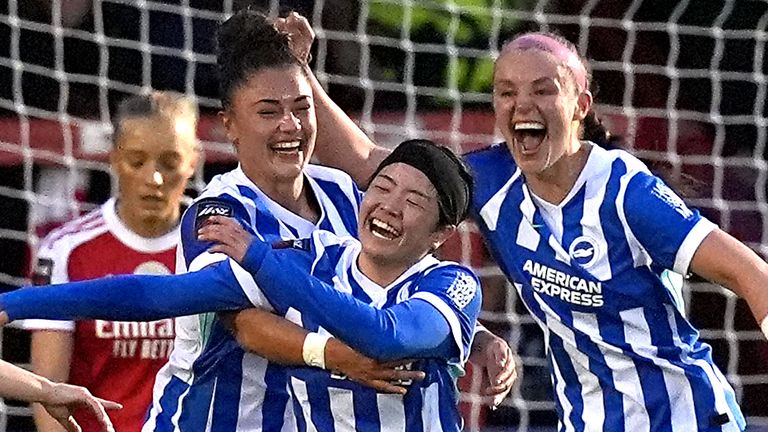 Fuka Tsunoda (middle) celebrates her goal for Brighton against Arsenal