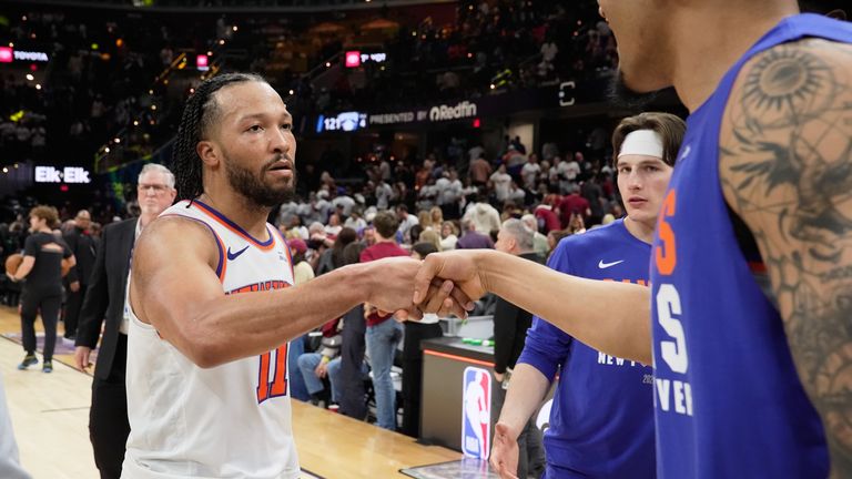 New York Knicks guard Jalen Brunson (11) celebrates with teammates after winning 