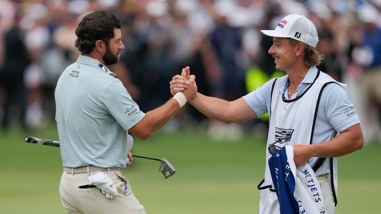 Young (left, with his caddie) started his final round six shots clear of a chasing pack of players, which included Scottie Scheffler,