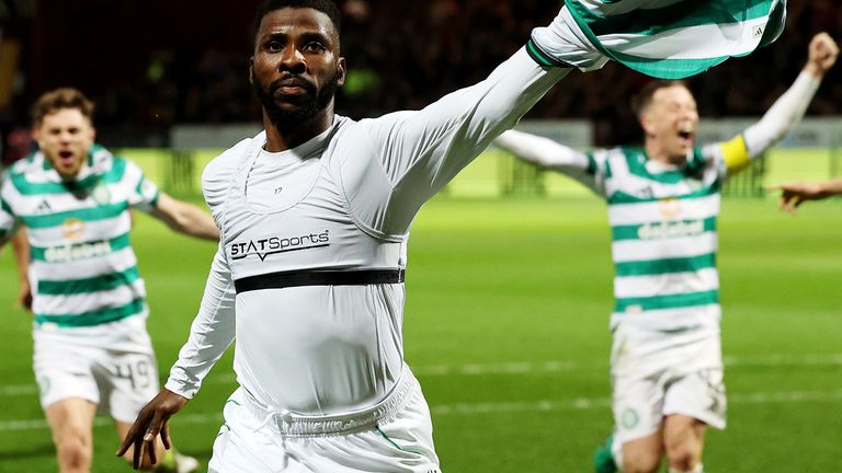 Kelechi Iheanacho celebrates scoring Celtic's winning goal at Motherwell from a penalty deep into stoppage time