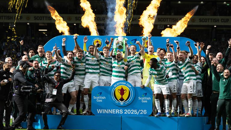 Celtic Captain Callum McGregor lifts the Scottish Cup trophy